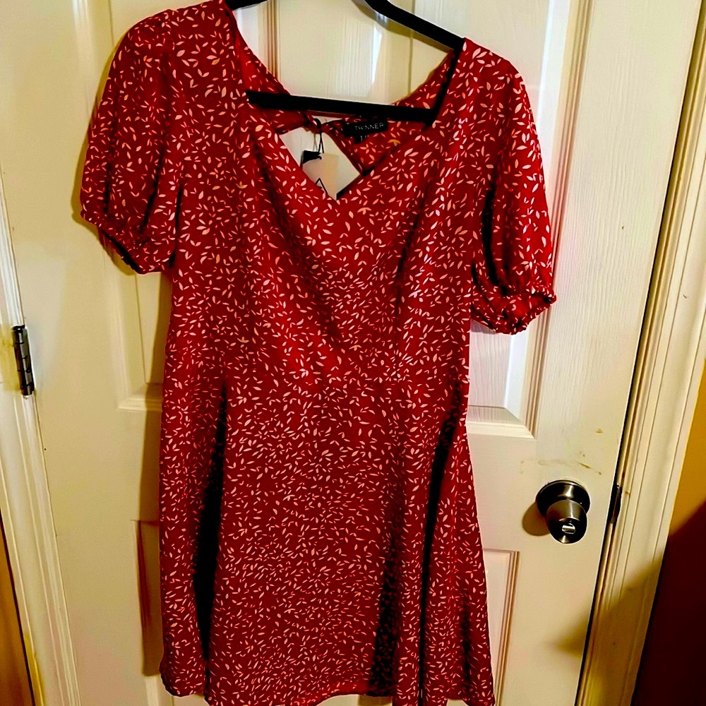 A beautiful red dress with a white leaf pattern, brand new with tags